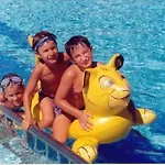 In A Poolside - Beahost * Bibione